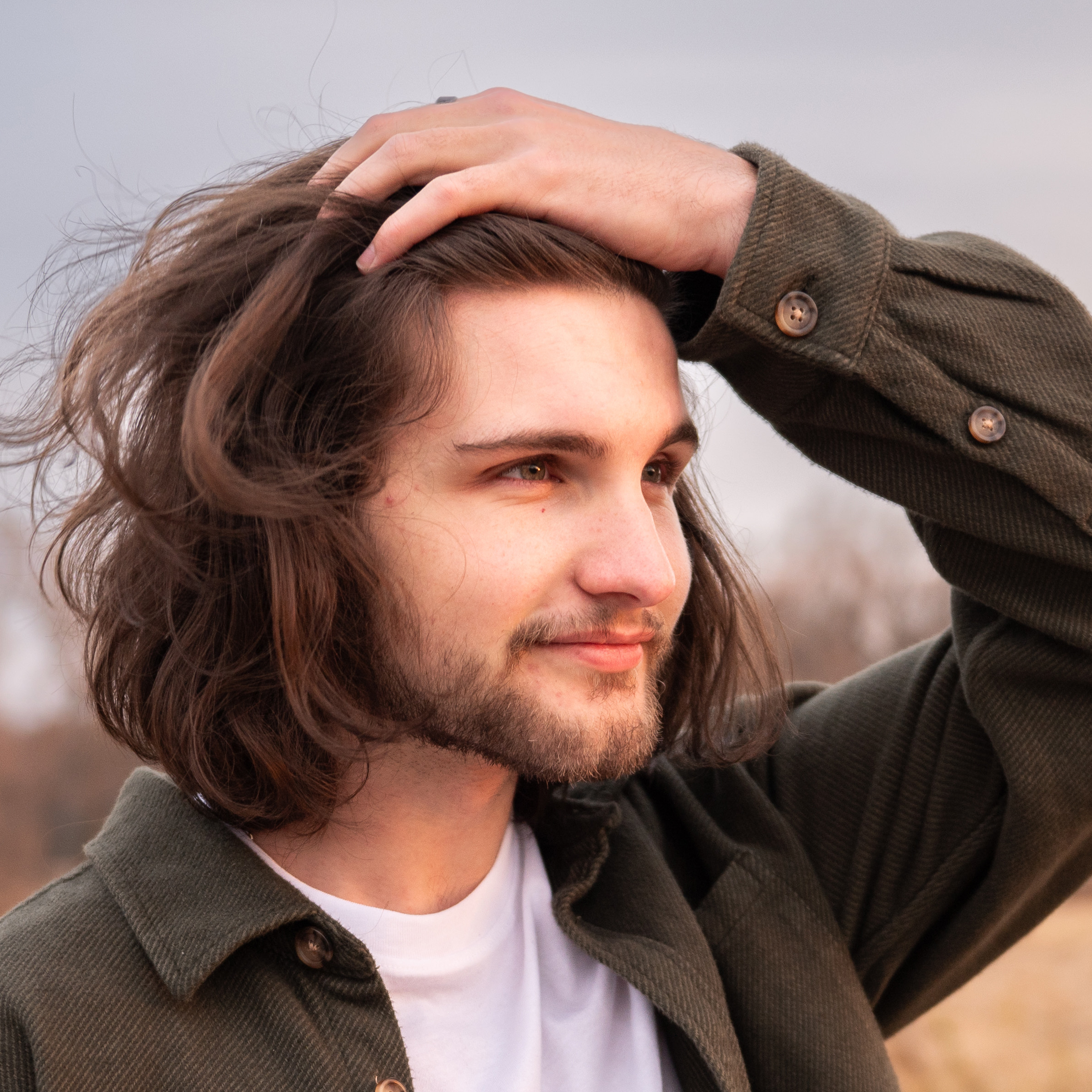 Outdoor photo of a young man in autumn.