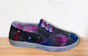 canvas shoe painted in galaxy colors with white dots
