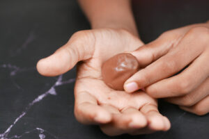 child holding chocolate candy in hands